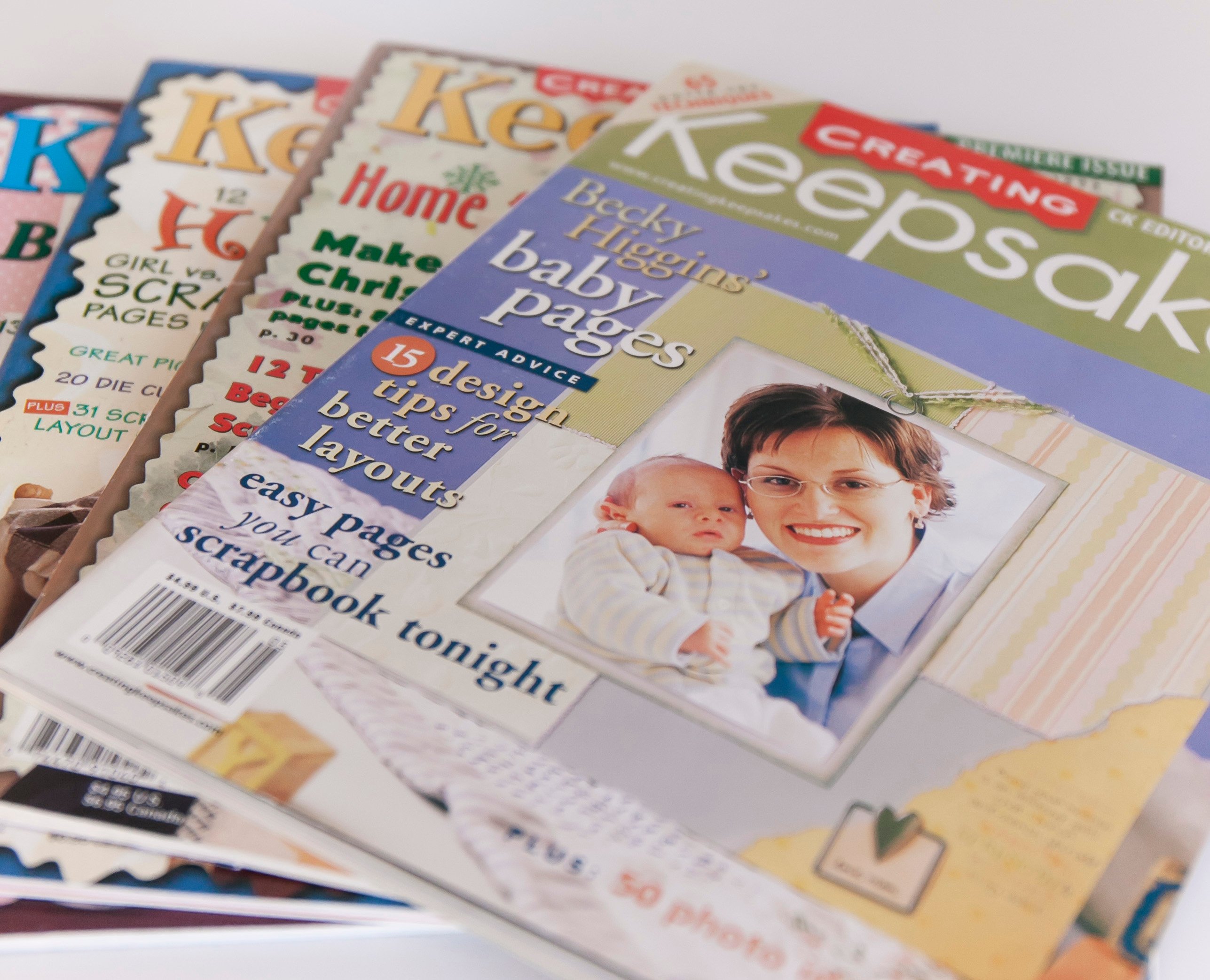 Early issues of Creating Keepsakes Magazine. Top Issue Features Becky Higgins.